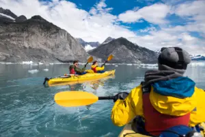 Group,of,friends,enjoy,ocean,kayaking,bear,glacier,during,their