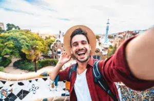 Happy,tourist,take,selfie,self Portrait,with,smartphone,in,park,guell,
