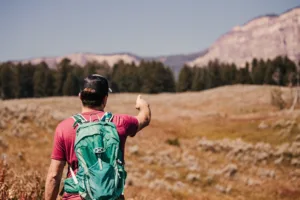 A,young,man,looking,on,to,yellowstone,national,park